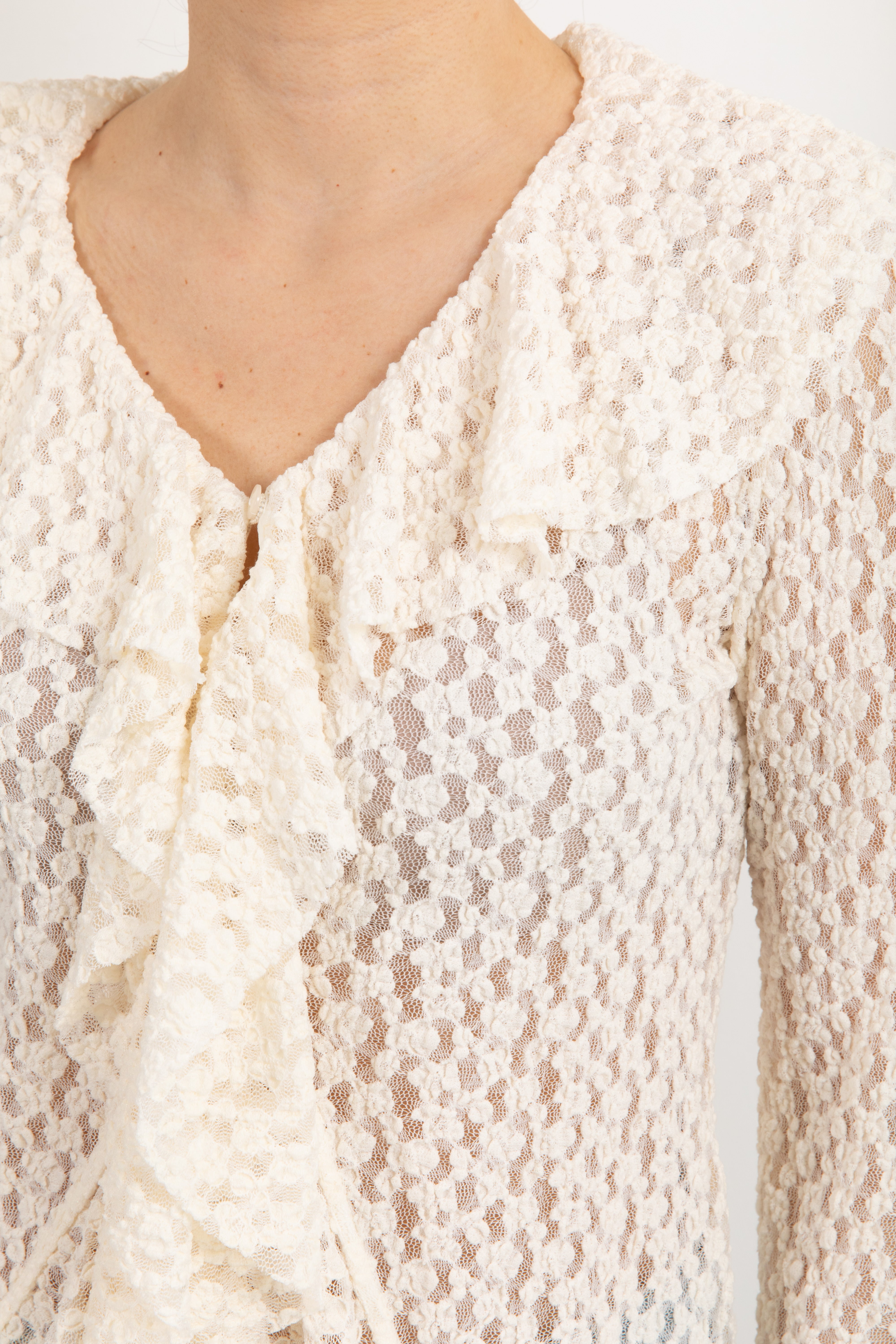 Blusa in pizzo goffrato con rouches Tensione In