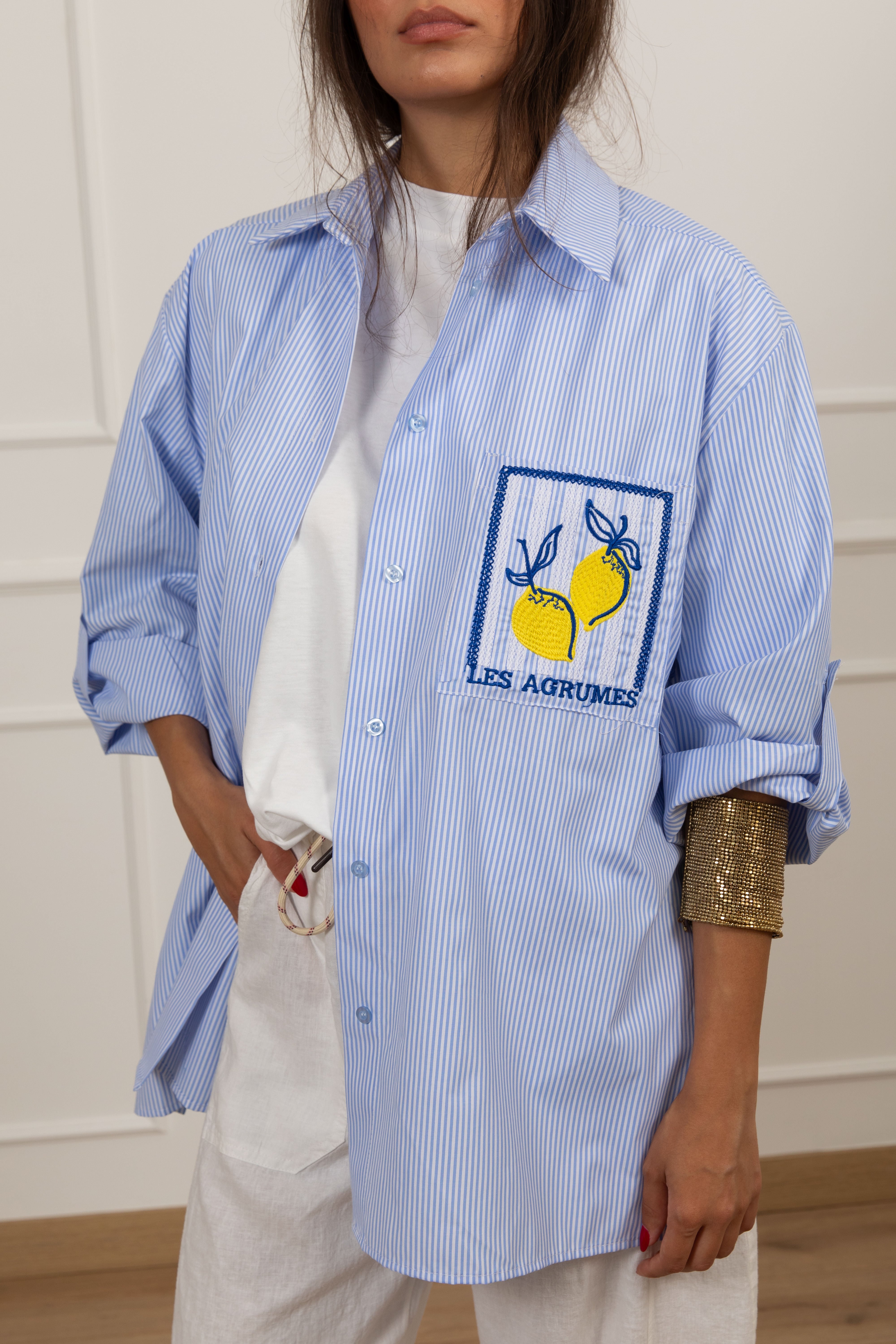 Camicia over-size bacchettata con tasca e frase Tensione IN