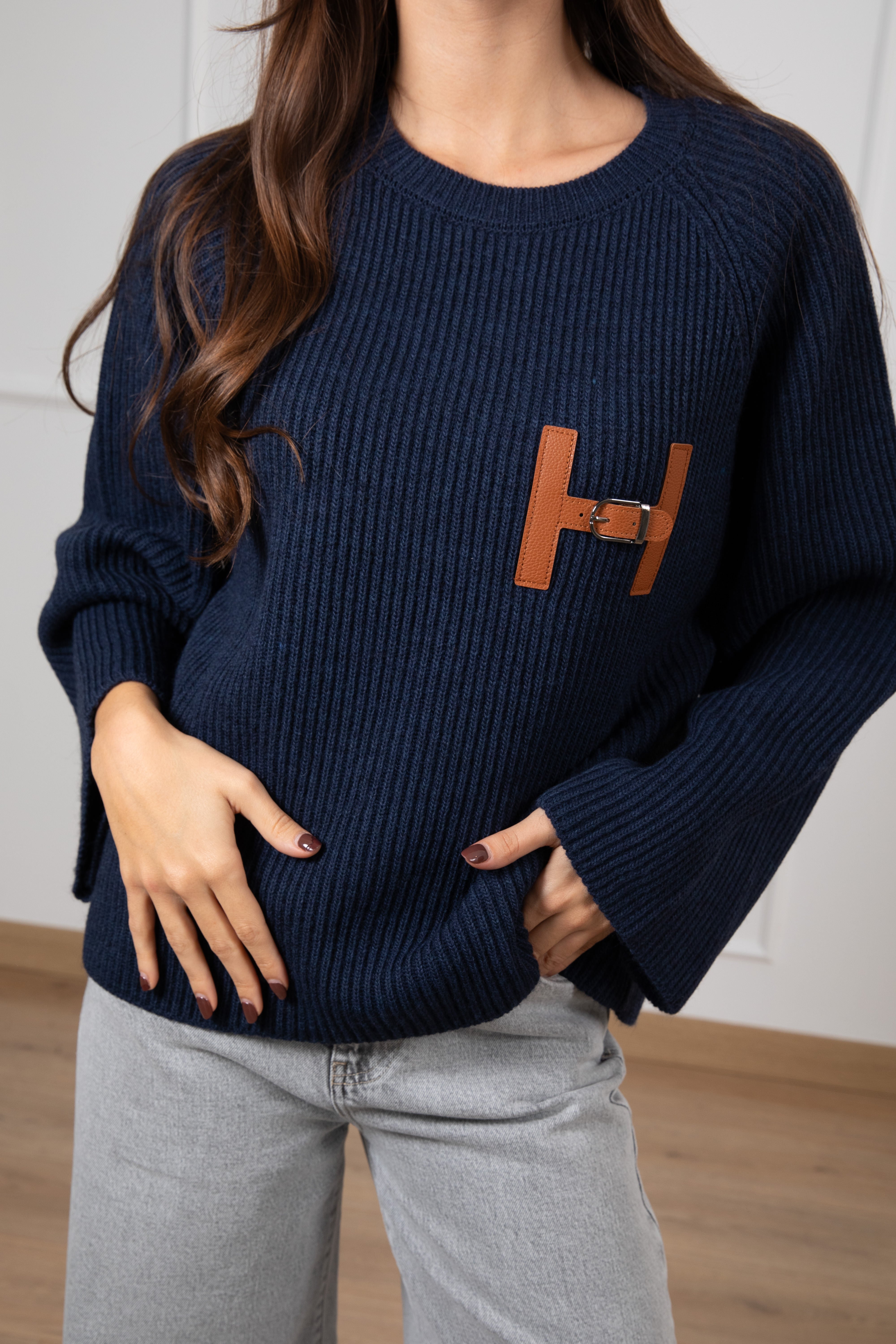 Pull con "H" in eco-pelle Tensione IN