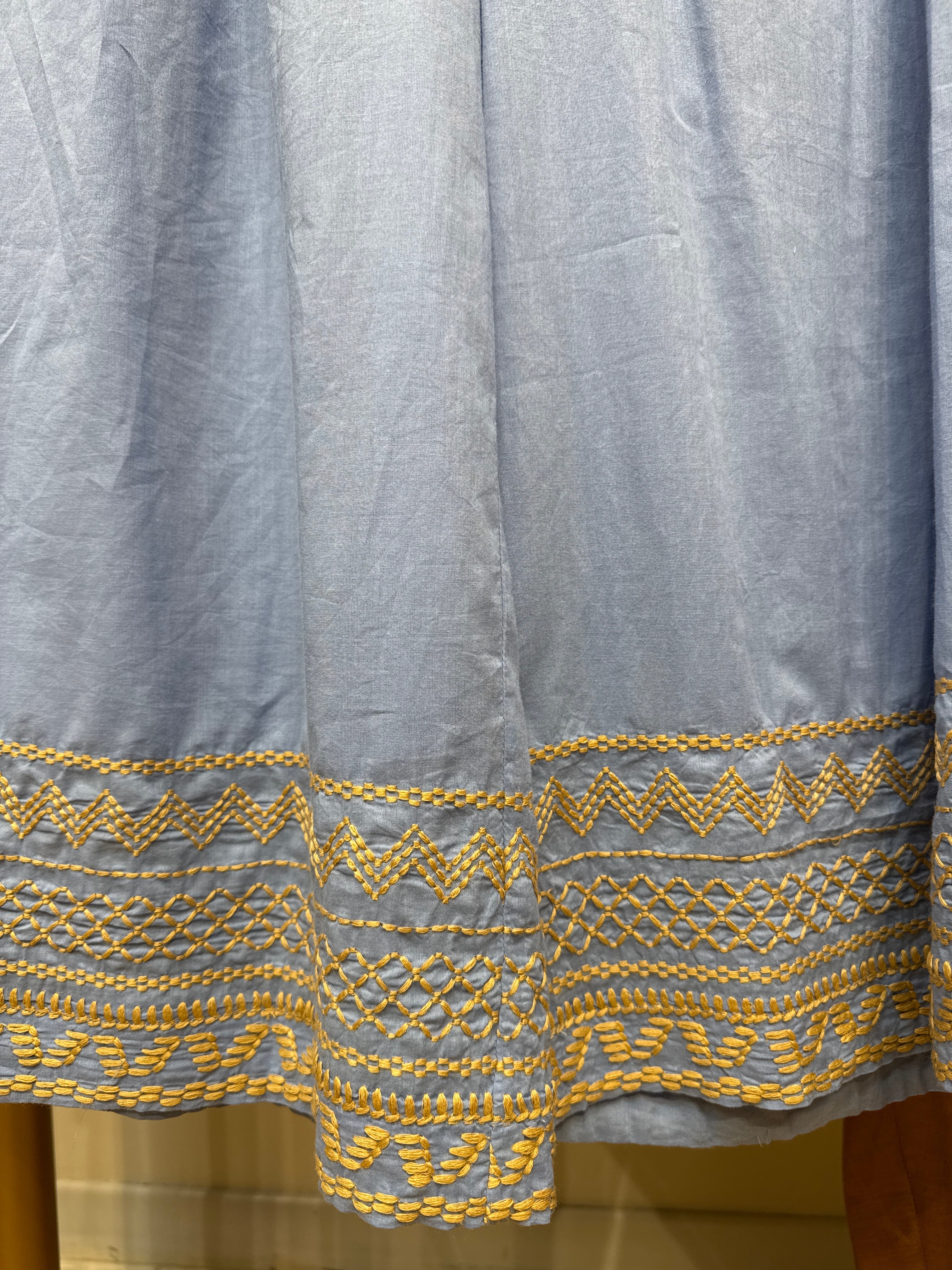 Pantalone in cotone con nappine e ricamo floreale Dixie